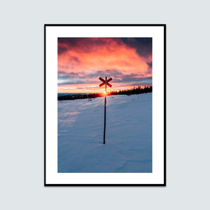 Solnedgång bakom ledkryss